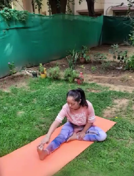 Ahida Sarmai while practicing yoga