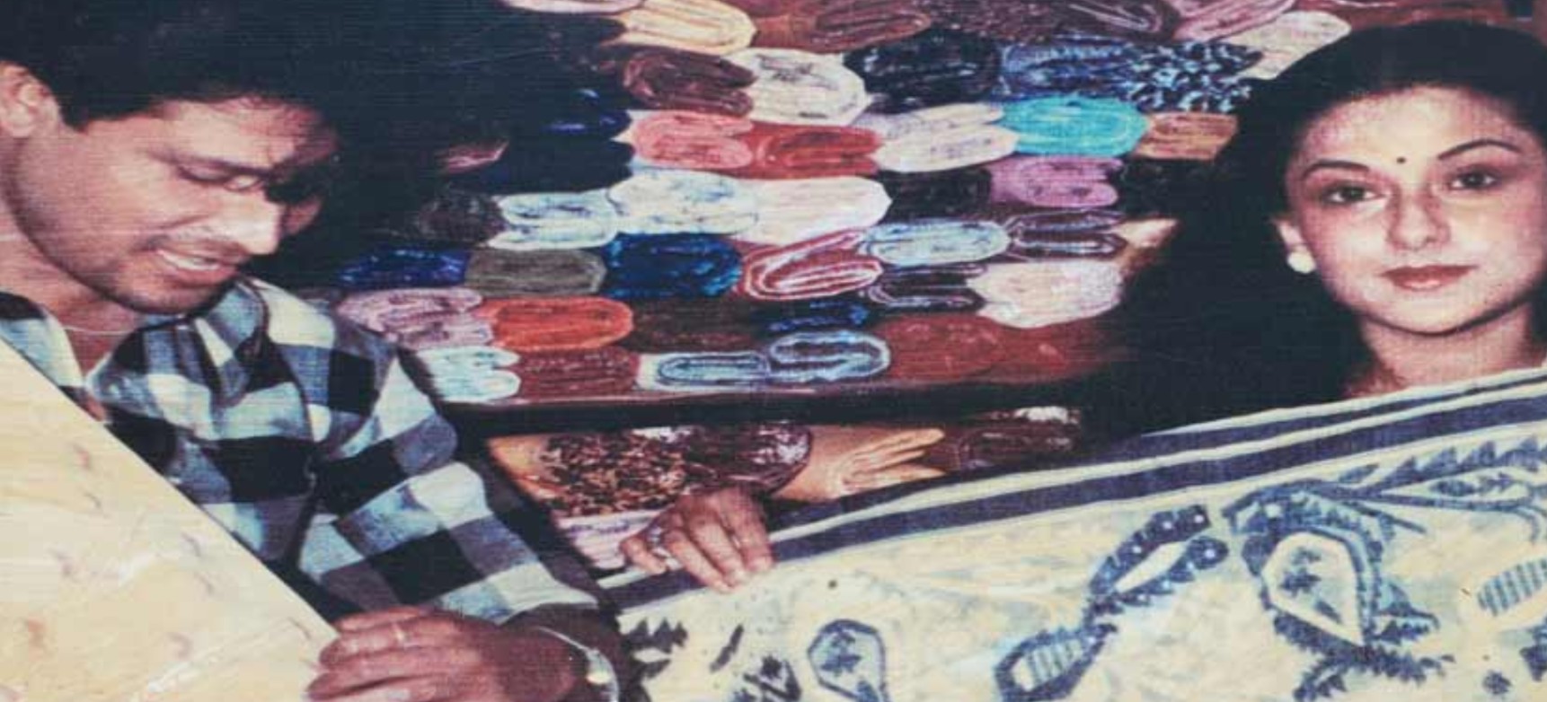 Biren Kumar Basak while showing sarees to a celebrity