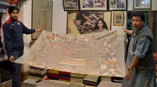 Biren Kumar Basak with his son (left)