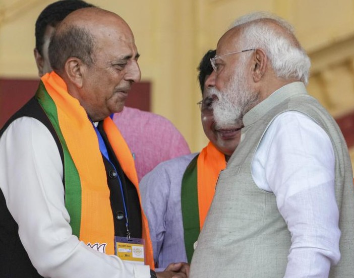 Dinesh Trivedi while greeting Prime Minister Narendra Modi