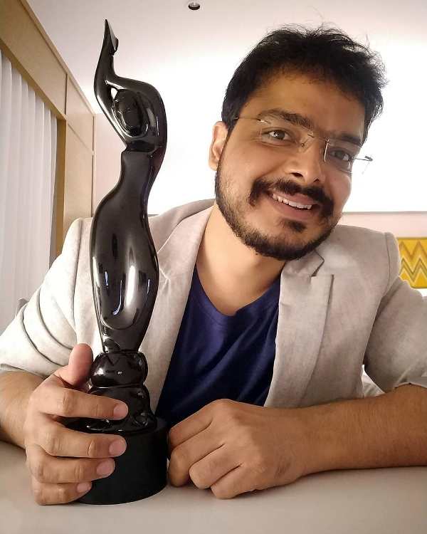 Gaurav Solanki, while holding the Best Story award, which he won for 'Article 15' at the 65th Filmfare Awards (2020)