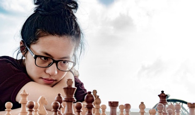 Hou Yifan while playing chess at an event