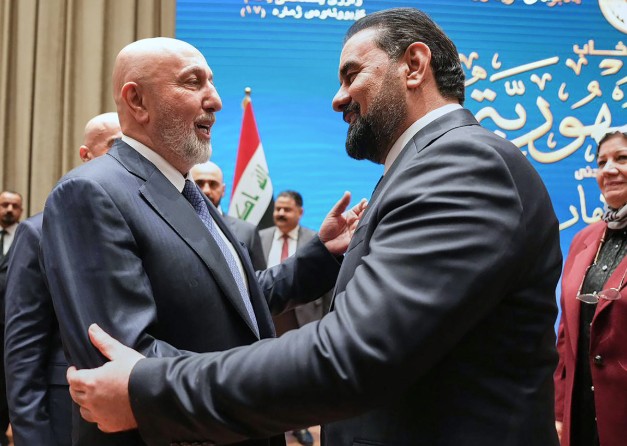 Iraq's Parliament Speaker Haibet al-Halbousi (right) congratulates President Nizar Amidi (left) after an election in in Baghdad, Iraq