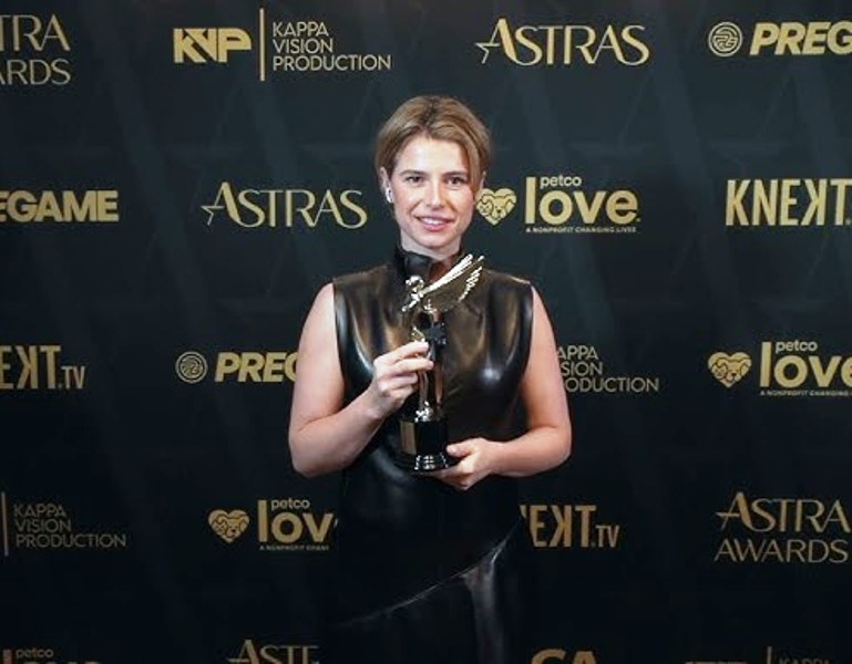 Jessie Buckley with an award she won at the 9th Astra Film Awards (2026)