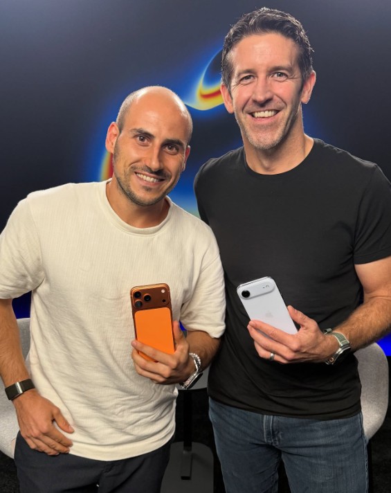 John Ternus posing with an Apple product