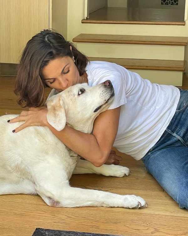 Nadia Farès with one of her pet dogs