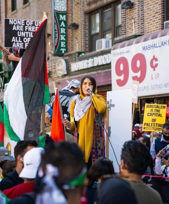 Nerdeen Kiswani speaking during a protest at CUNY