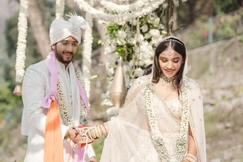 Sumukha with his wife on their wedding day