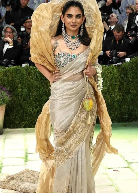 Isha Ambani at MET GALA 2026 while holding a mango clutch designed by Subodh Gupta