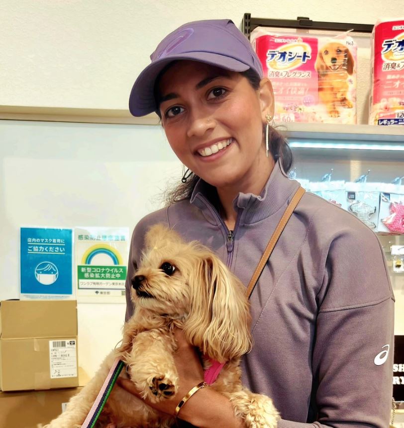 Karman Thandi with a dog