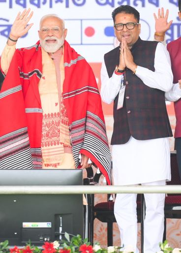Manab Deka with Narendra Modi during election campaigns