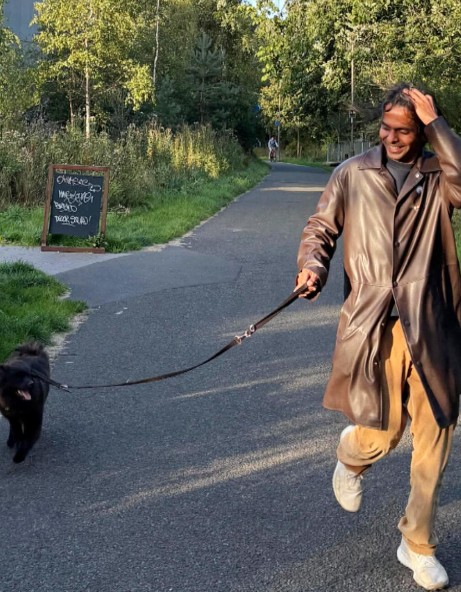 Q Manivannan with their pet dog