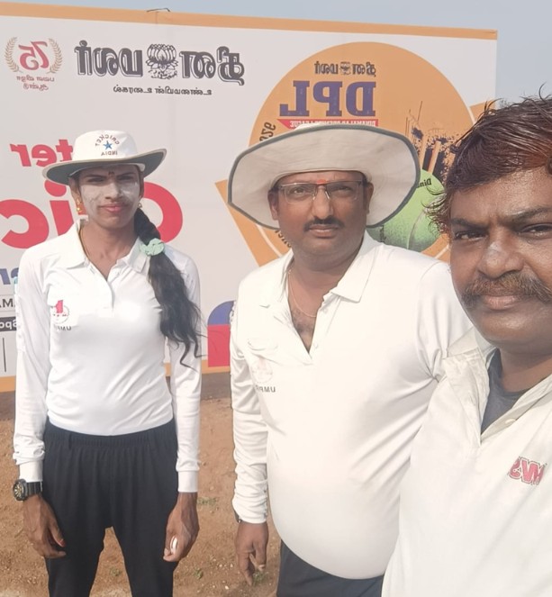 Rithika Sri posing with her senior officials on a cricket ground