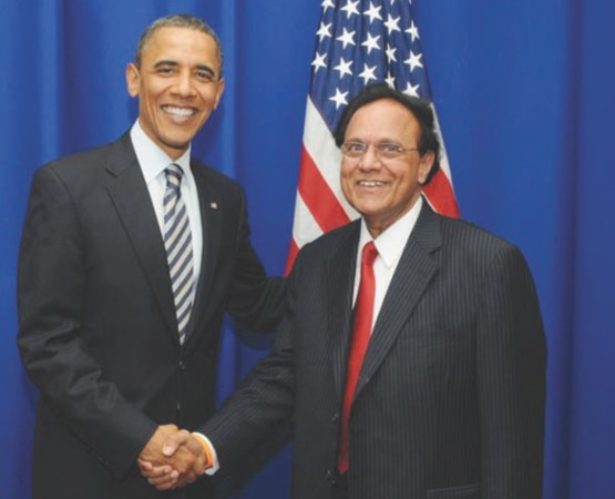 Dattatreyudu Nori posing with Barack Obama in the United States of America