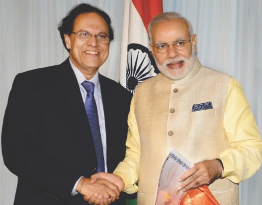 Dattatreyudu Nori posing with Narendra Modi, Indian Prime Minister