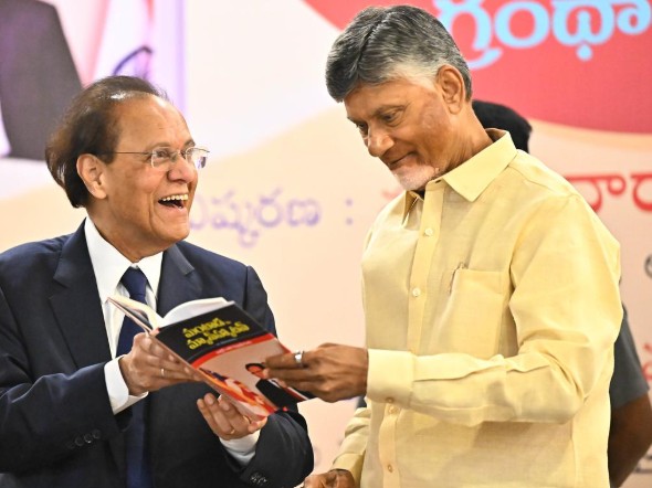 Dattatreyudu Nori while launching one of his books with the Chief Minister of Andhra Pradesh, India