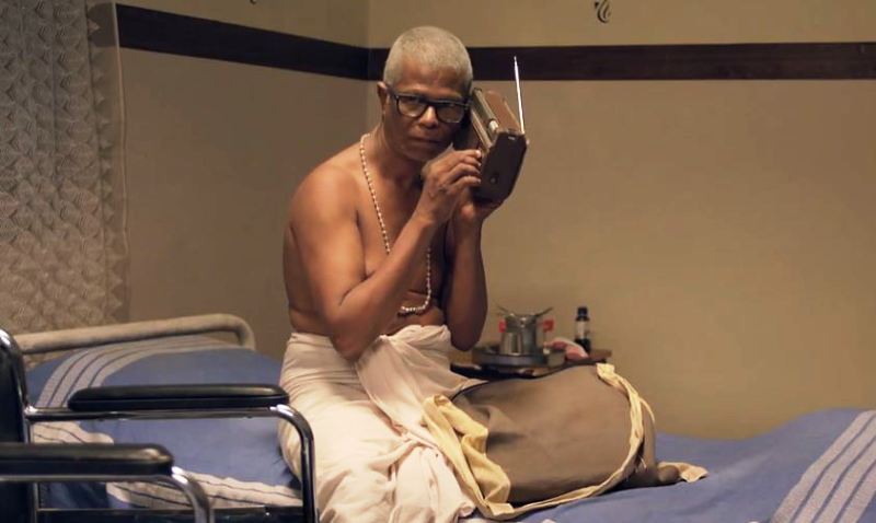 Indrans as 'Pappu Pisharody' in a still from the film 'Aalorukkam' (2018)