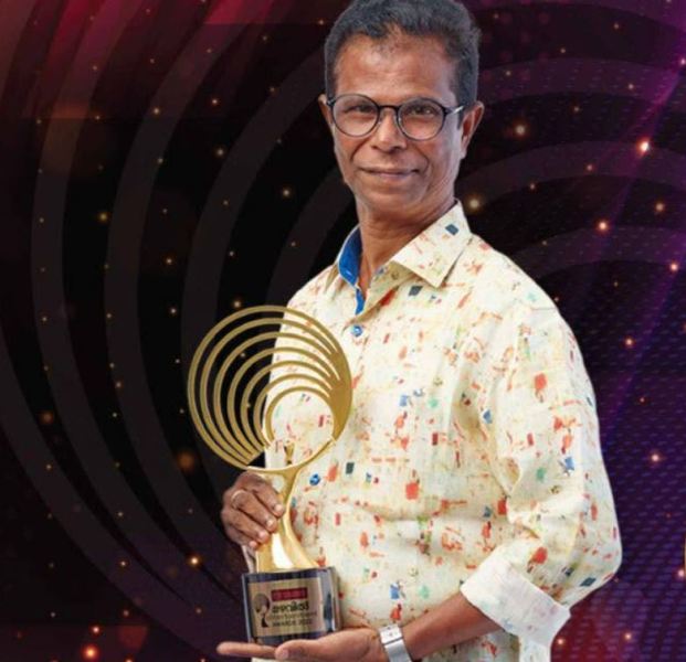 Indrans with the Best Entertainer - Character Role award, which he won at the 2022 Mazhavil Entertainment Awards