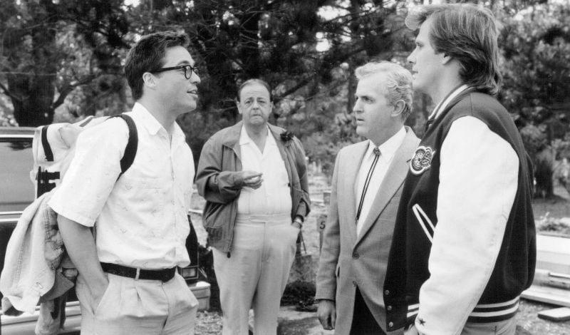James Handy (second from the right) as 'Milton Briggs' in a still from the film 'Arachnophobia' (1990)