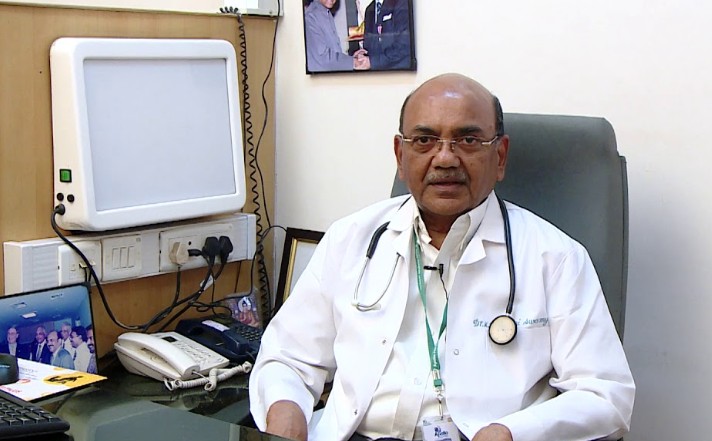 K. R. Palaniswamy posing at his work