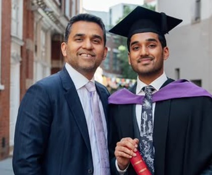 Shamsheer Vayalil with one of his children, Faadil