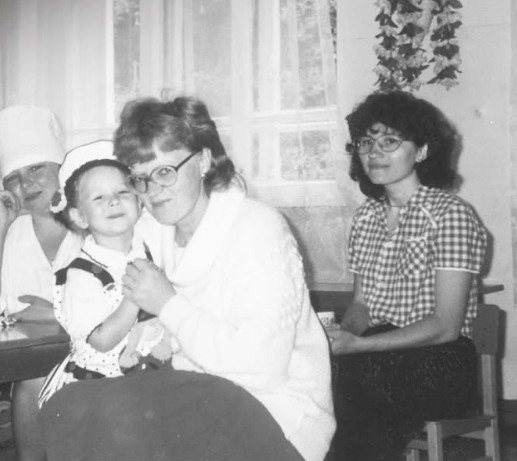 A childhood picture of Angela Nikolau with her dance teachers