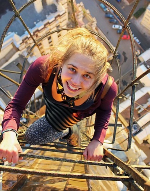 An old picture of Angela Nikolau while climbing a tower