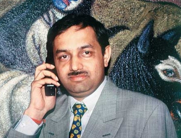 An old picture of Mahendra Nahata while answering a call