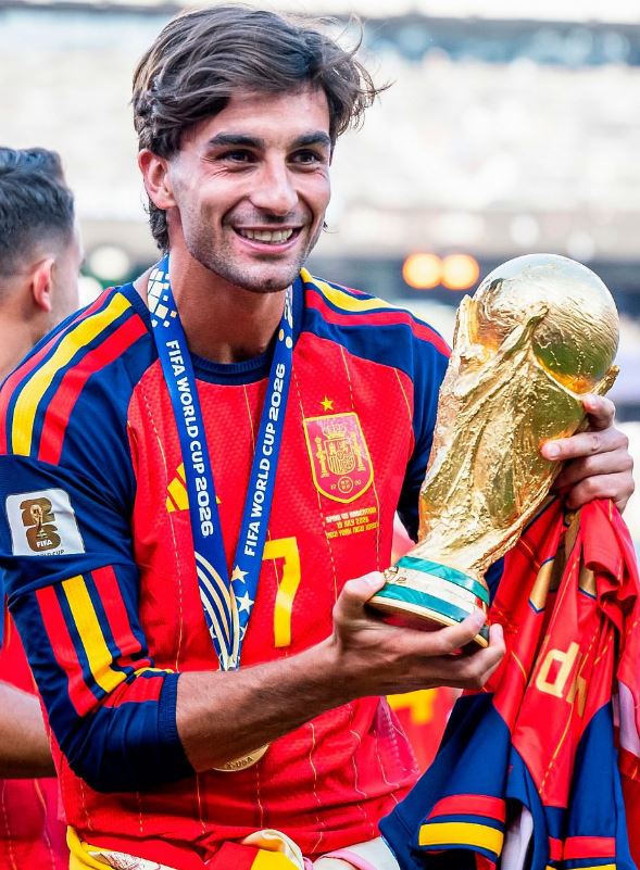 Ferran Torres holding FIFA World Cup 2026 Trophy