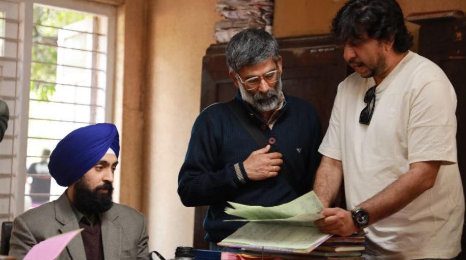 Honey Trehan (right) with Diljit Dosanjh (seated) as other cast on the set of Satluj (2026)
