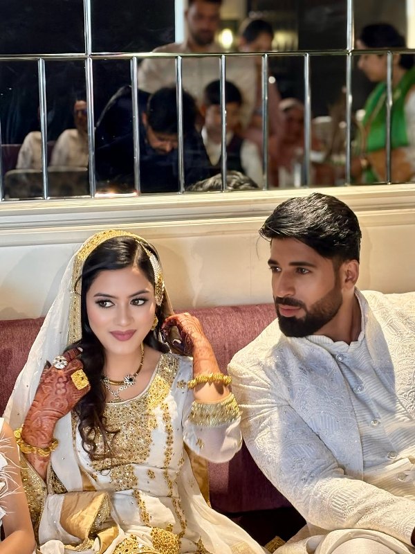 Mohsin Akhtar Mir and Nidhaa Bhatt on their wedding day