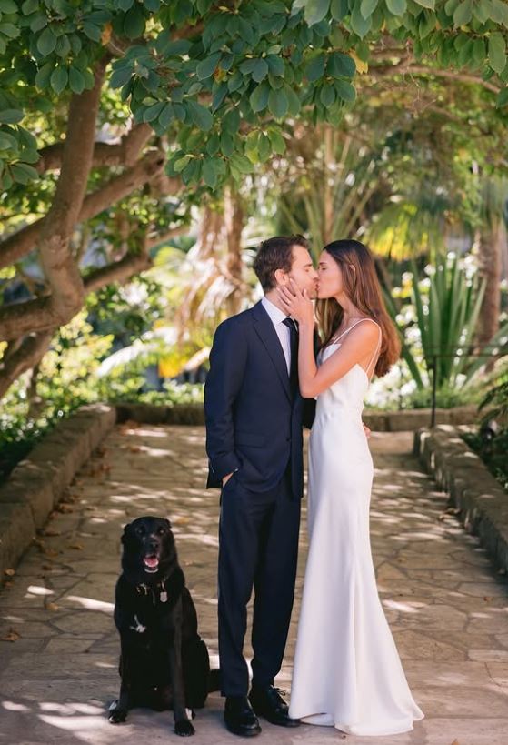 Natalie Kuckenburg and Paul Wesley on their wedding day with their pet dog