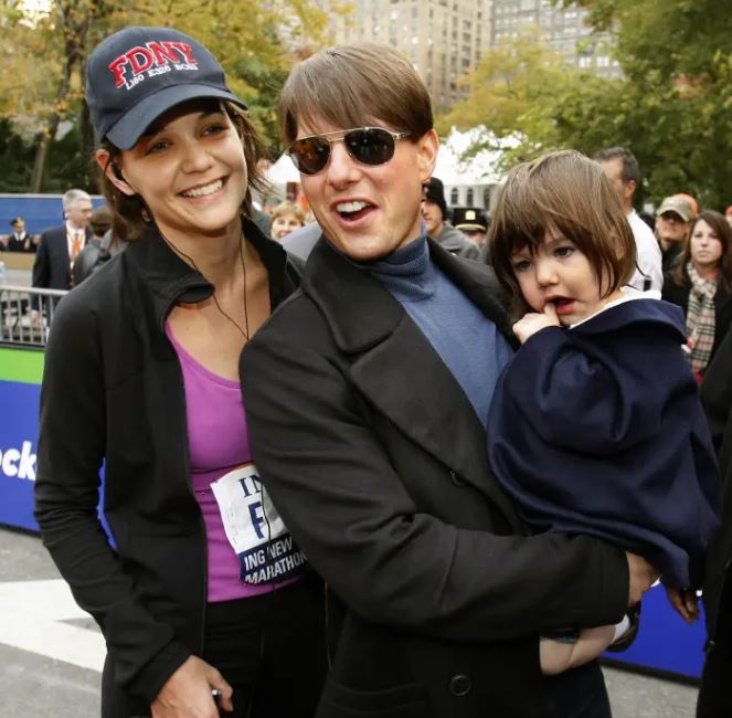Suri Noelle with her parents, Tom Cruise and Katie Holmes