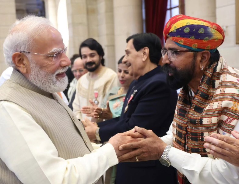 Taga Ram Bheel while meeting Narendra Modi