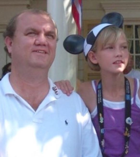 A childhood picture of Karlie Kloss with her father
