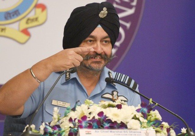 Birender Singh Dhanoa speaking during a conference