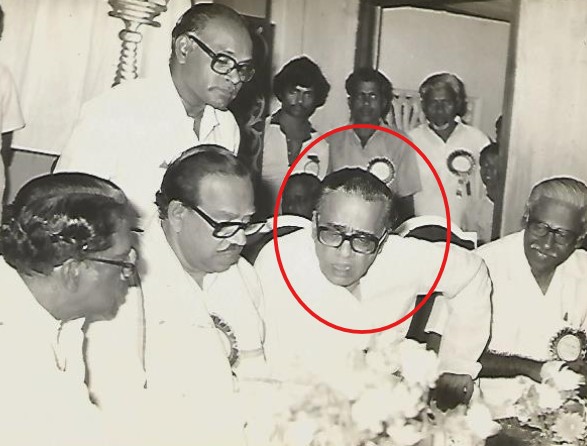 H. V. Hande during a meeting