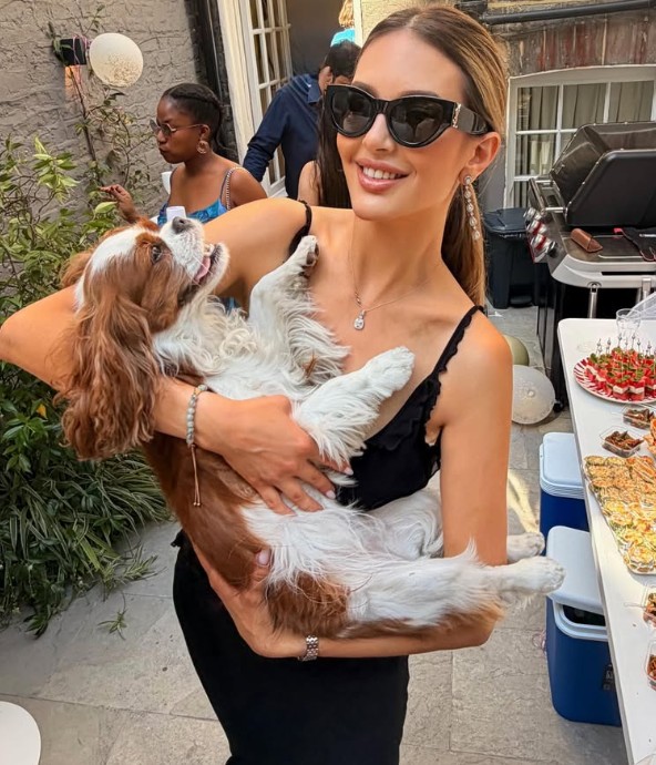 Oksana Voevodina posing with her pet