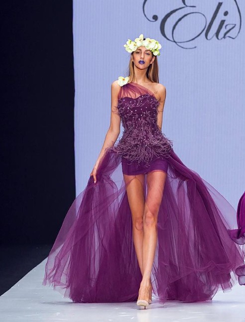 Oksana Voevodina while walking the ramp