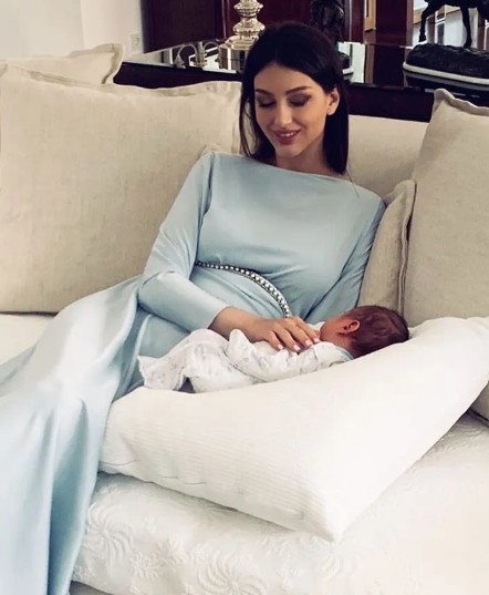 Oksana Voevodina with her baby at their Malaysian home