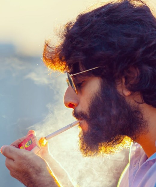 Teja Kalvakota while smoking a cigarette
