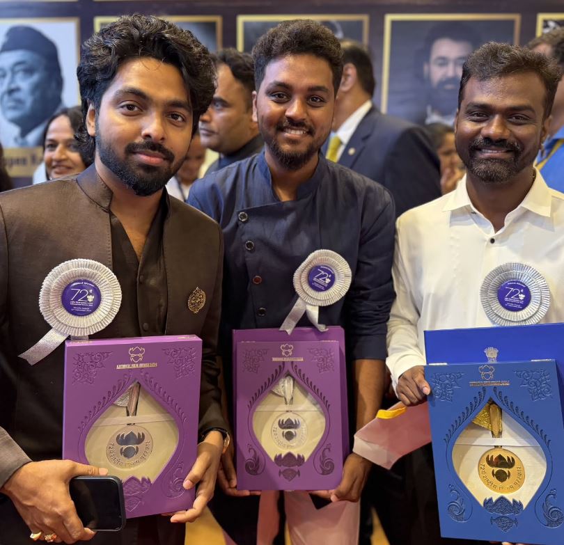 R. Kalaivanan (middle) posing with his National Award for Best Editing for the film Amaran