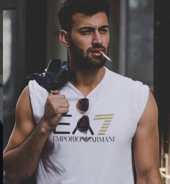 Rohed Khan while smoking a cigarette