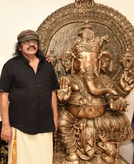 Soorya Krishnamoorthy posing with a Ganesha idol at his home