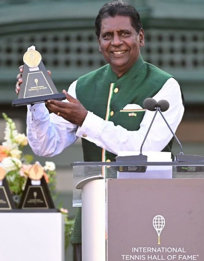 Vijay Amritraj posing with his International Tennis Hall of Fame's Golden Achievement Award