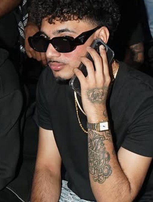YUNG DSA's tattoos on his left arm and hand