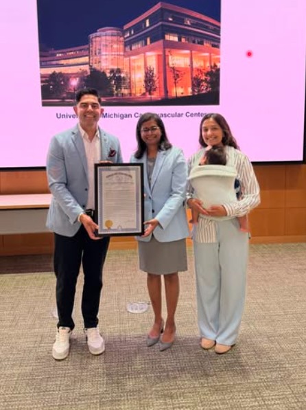 Ranjeev Puri and his wife, Nidhi, at Michigan Medicine while presenting Dr. Santhi Ganesh with a commemorating House Resolution 246 during Spontaneous Coronary Artery Dissection (SCAD) Awareness Week
